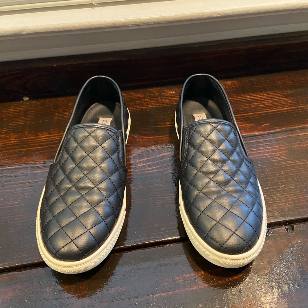 Black quilted slip on sneakers